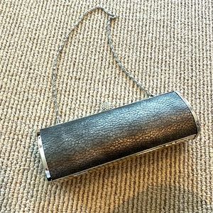 Expressions NYC clutch or strap purse your holiday parties.